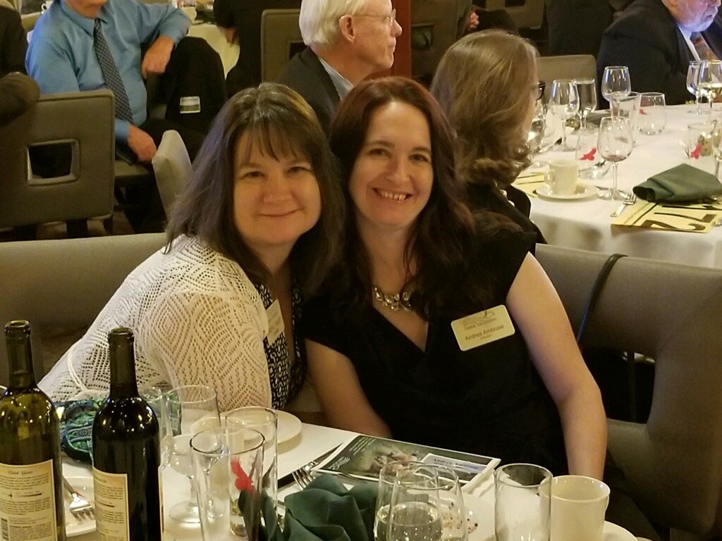 Educator Andrea Ambrose and Volunteer Cheryl Faust pose together at the Benefit for the Birds Gala