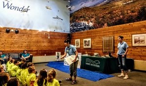 Alyssa and fellow trainee Diana host an elementary school field trip with the Raptors Over the Ridge introduction program.