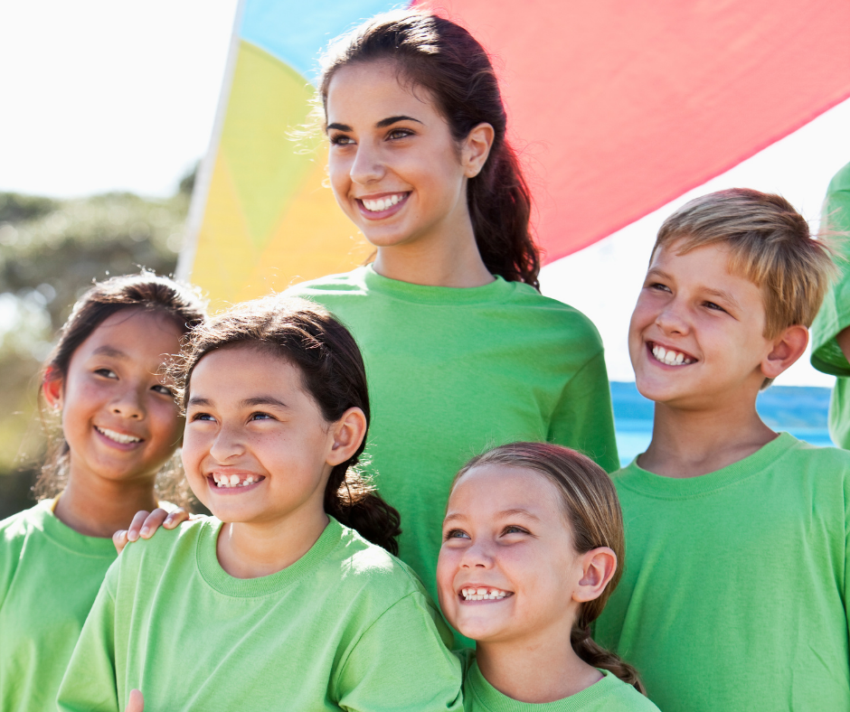 Camp Counselor Posing with Campers