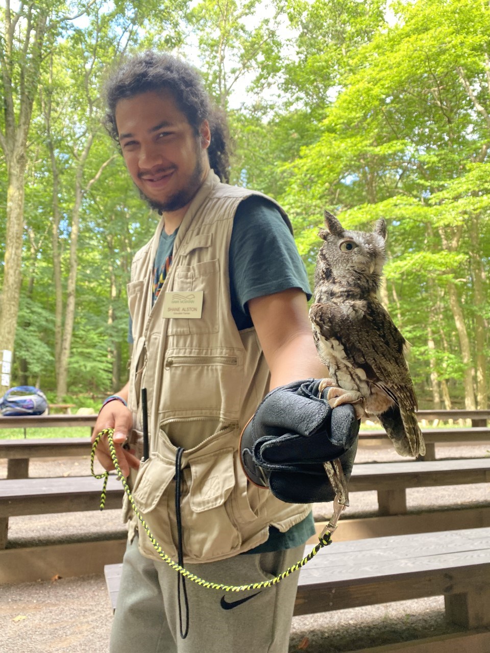 Education Intern Shane Aston with screech owl